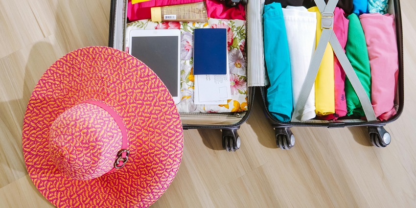 A packed suitcase ready for vacation with essential items organised for Masinagudi trekking.