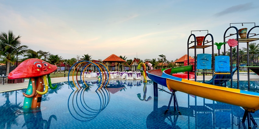 Picturesque view of a water park with various rides and water slides and a pool for kids