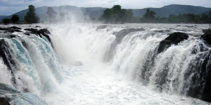 View of the silver water cascading down the rocks into a white pool