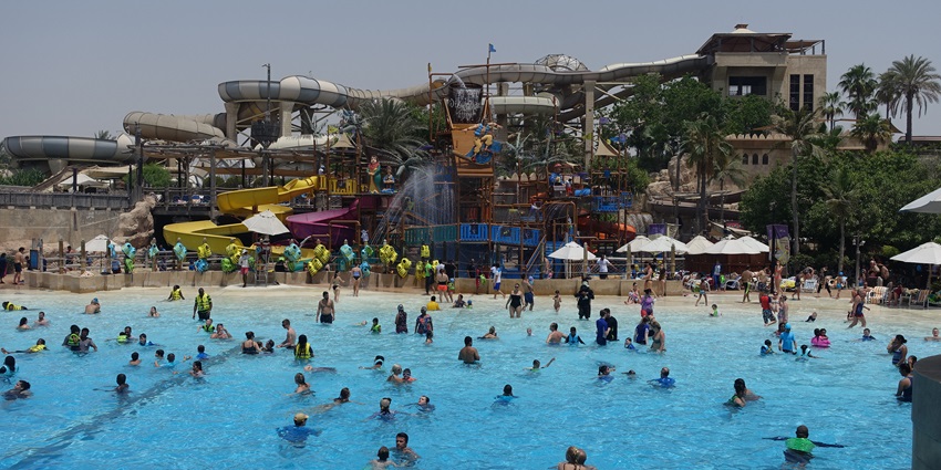 A picture of the Kalyan Water Park with people enjoying their time in the swimming pool