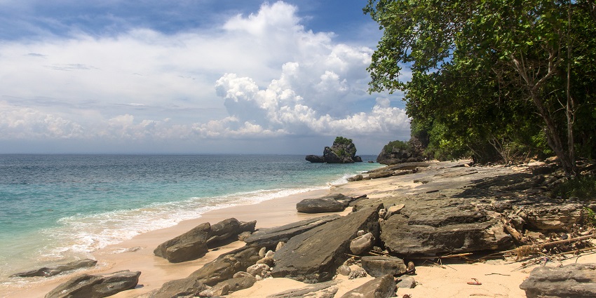 Scenic view of Padang Padang Beach in Bali with waves crashing