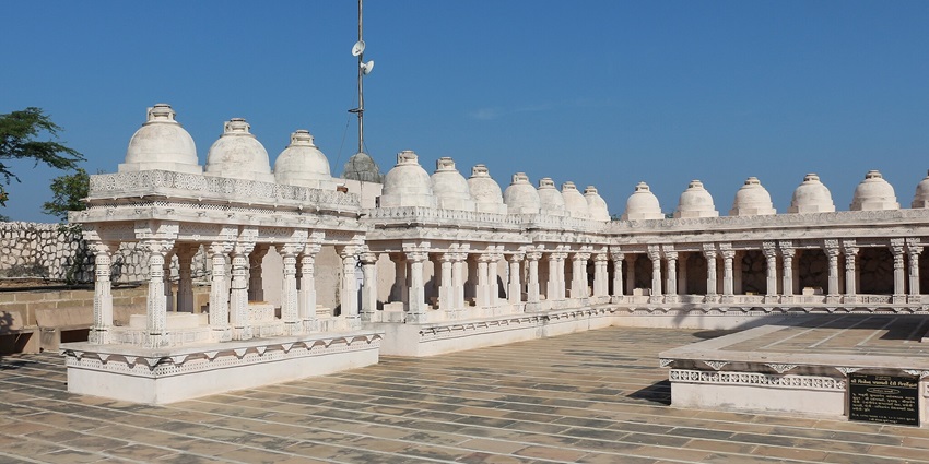 A serene view of Padmavati Mandir with intricate architecture and lush surroundings