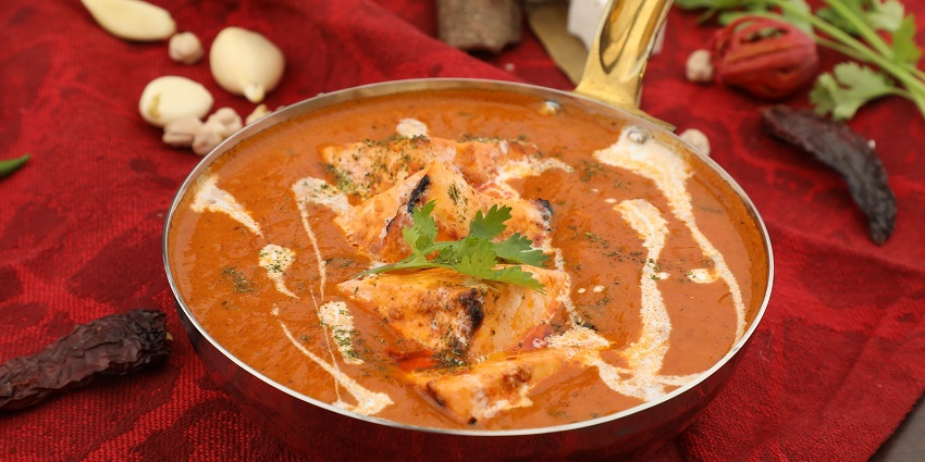 Image of Malai Paneer, a culinary delicacy served on a plate garnished with cilantro.