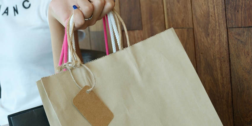 Woman holding shopping bags - The fine craftery of Pallavi Jaikishan saree shopping place in Mumbai