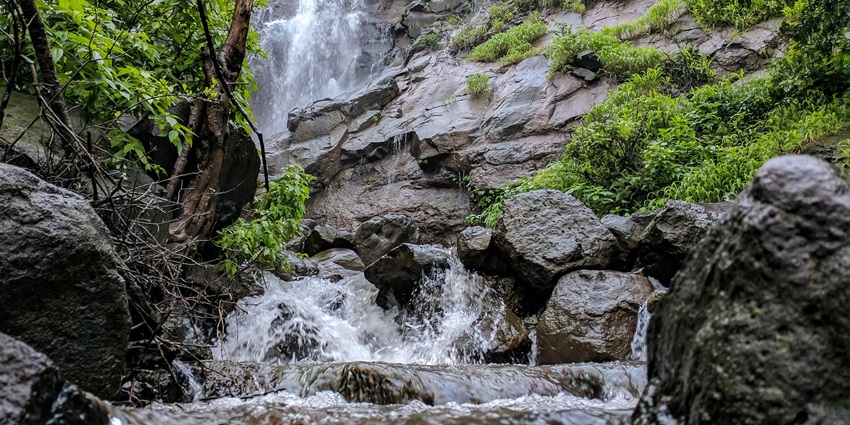 Palucha Waterfall features stunning cascade, lush surroundings, perfect for relaxation.