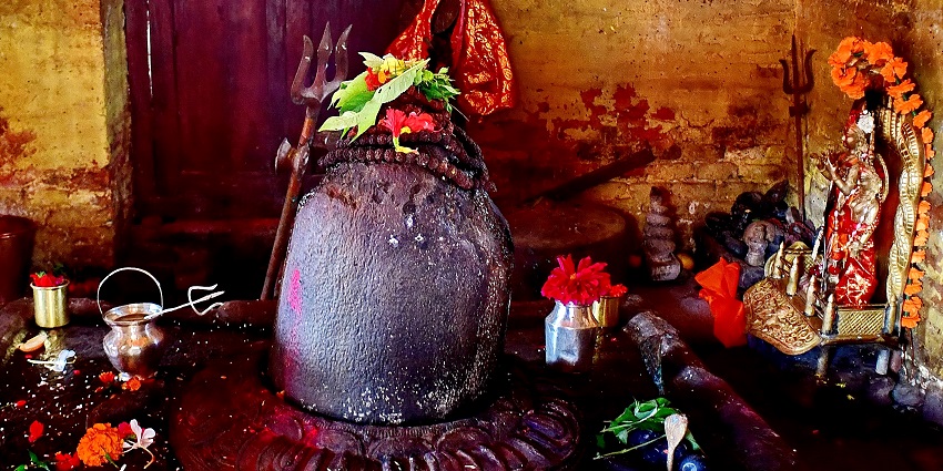 An image view of Panchali Kund, a serene Shivling surrounded by lush vegetation and tranquil scenery.