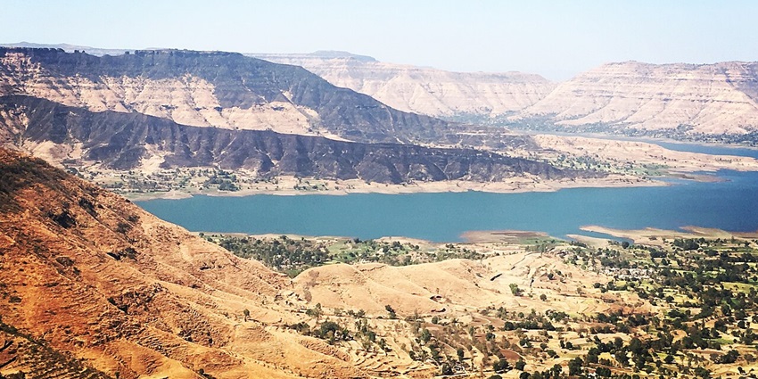 Scenic view of Panchgani hills with green valleys, plateaus, and distant mountains