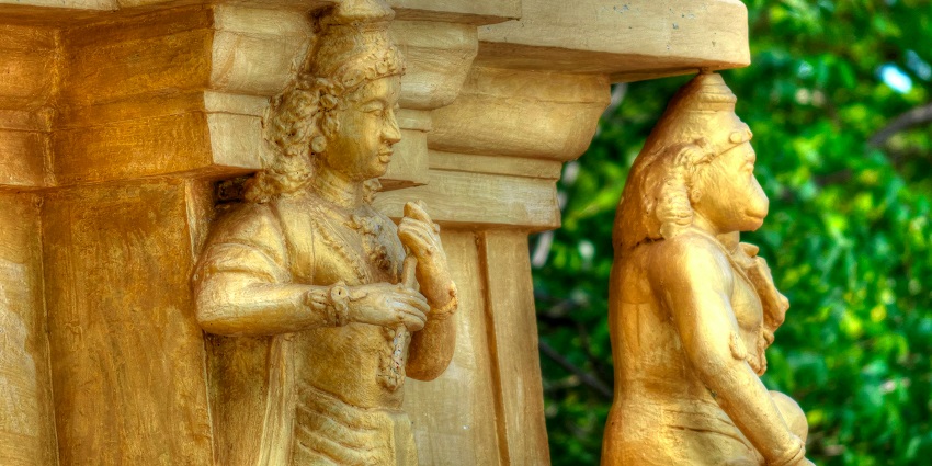 A close-up of Hanuman in orange attire, reflecting Hanuman temples in Pune's artistry.