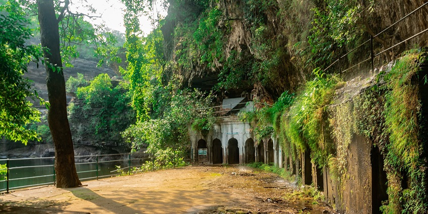 Ancient rock-cut caves, showcasing exquisite carvings and historical significance