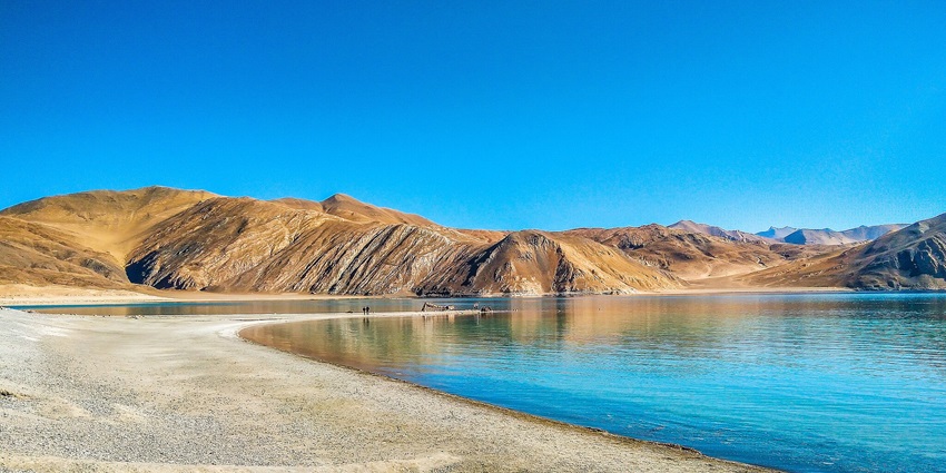 Pangong Lake in Ladakh, renowned for its stunning blue waters and mountain scenery.