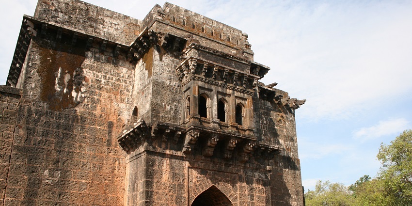 A scenic insight view of Panhala Fort with tourists near Mohini Water Park.