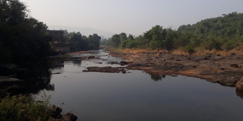 Panshet River flows through a landscape, a peaceful tourist attraction near Malhagad Fort.