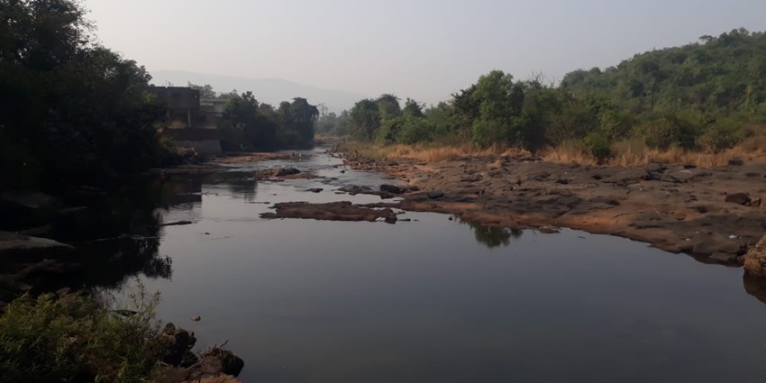 Scenic view of Panshet River near Krishna Water Park Pune, surrounded by abundant greenery and hills