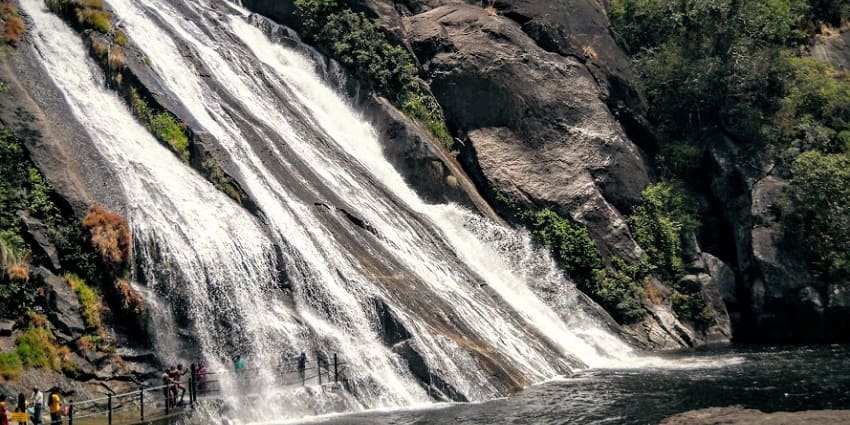 A serene view of Papanasam Falls, another popular waterfall near Manimuthar.