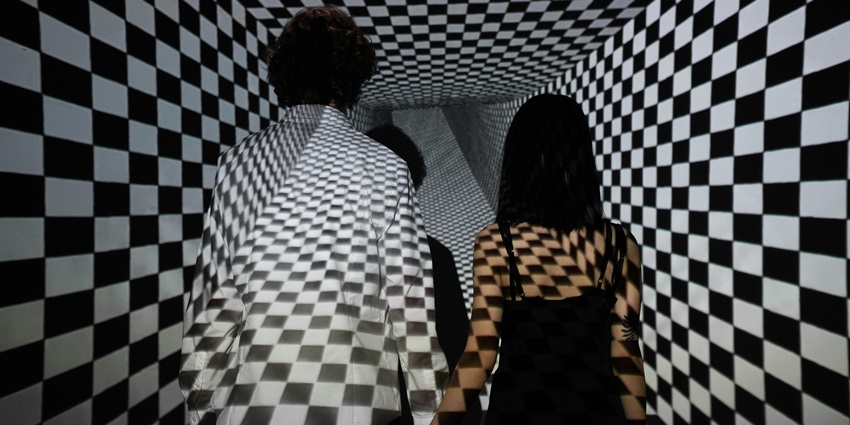 Image of a Couple Standing Together in a Checkerboard Projection