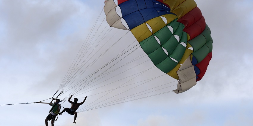 A picture of parasailing, a popular choice among water sports in Alibaug.