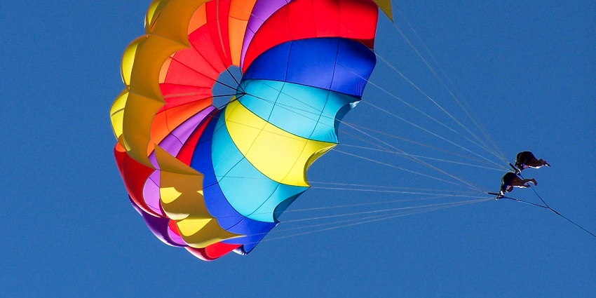 Soar above the water while parasailing for breathtaking views.
