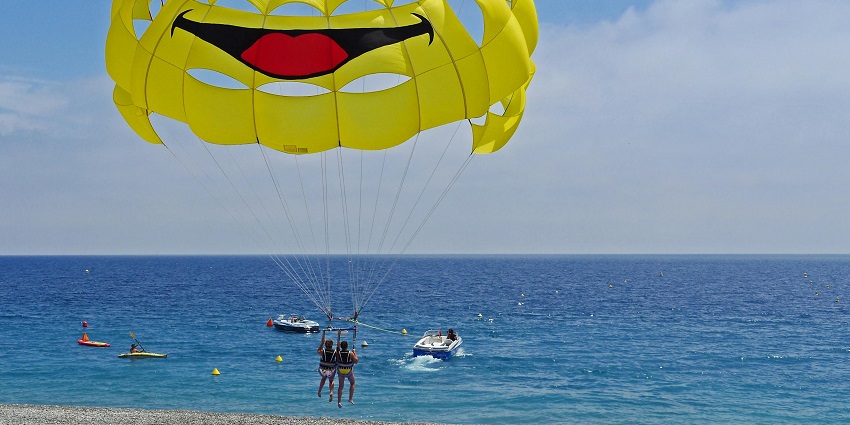 An image of a parasailer soaring high, one of the best Malvan water sports.