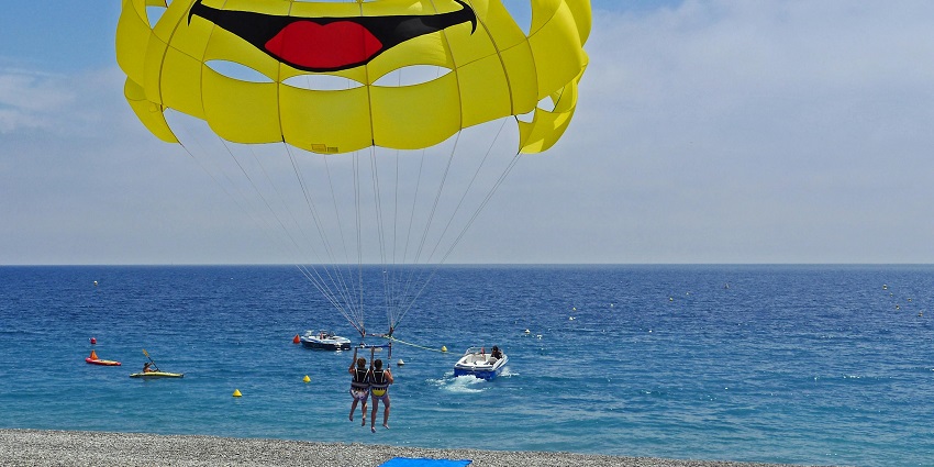 An image of a parasailer soaring above Lavasa's lake, enjoying panoramic views.