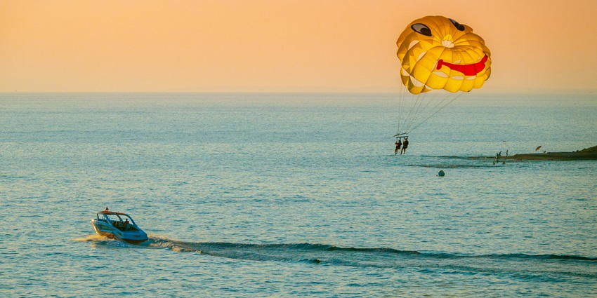 A glimpse of people relishing parasailing, one of the best things to do in Goa in April.