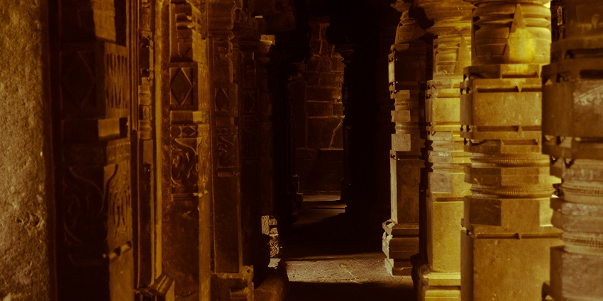 A hallway inside Bhuleshwar Temple, featuring ornate designs and spiritual ambiance.