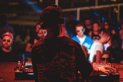 Image of a DJ playing music and people celebrating at one of the parties in Pondicherry