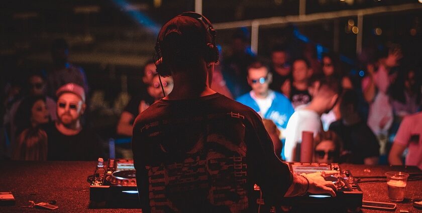 Image of a DJ playing music and people celebrating at one of the parties in Pondicherry