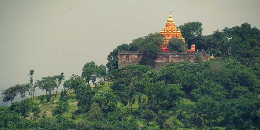 Scenic view of Parvati Hill, showcasing temple and lush greenery.