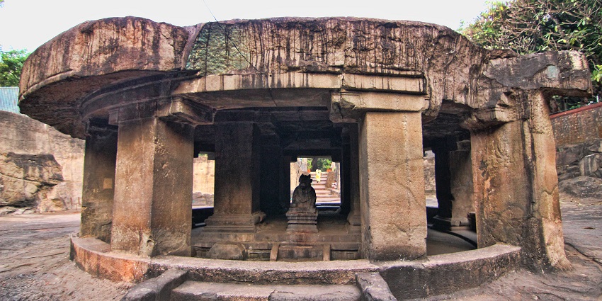 Picturesque view of Pataleshwar Cave Temple surrounded by rocks during day time view