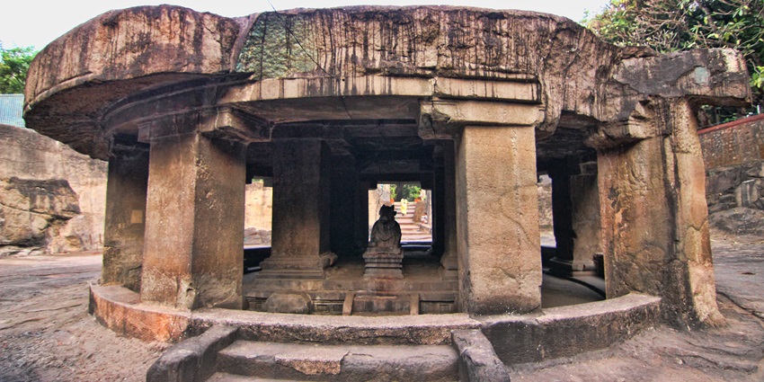 An ancient rock-cut temple with massive stone pillars and a circular Nandi mandapa, one of the best places to visit in winter in Pune.
