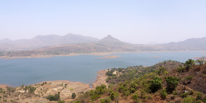 A panoramic view of Lake Pavna, the best place to visit near Tikona Fort in Maharashtra.