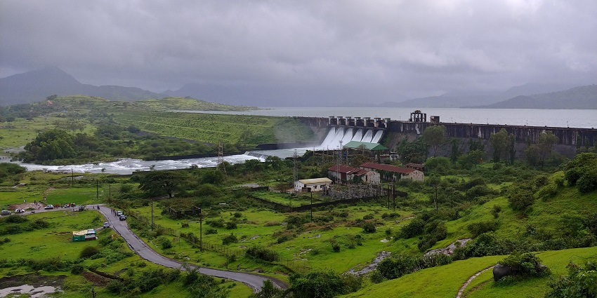 An image of Pawna Lake, a serene spot near the fort, with calm waters and greenery.