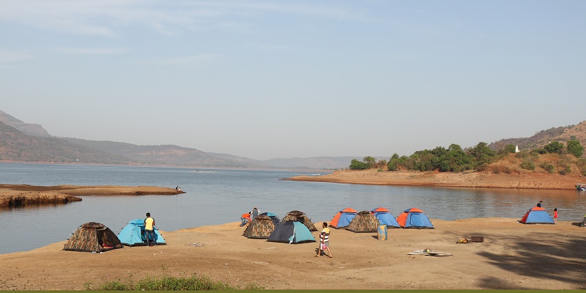 A picturesque view of Pawna Lake, one of the famous spots for camping in Lonavala.
