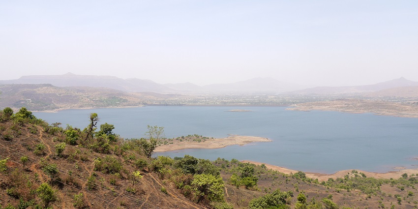 The expansive view of the Pawna lake, a perfect place for camping and picnicking.