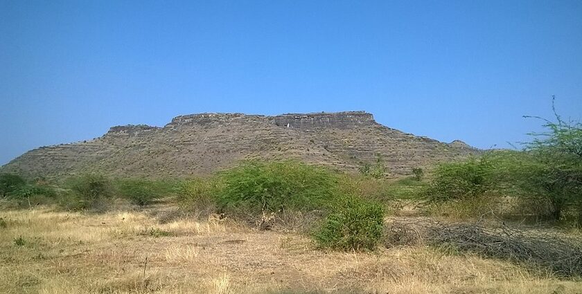 Exterior view of a historic fort showcasing its lush green surroundings