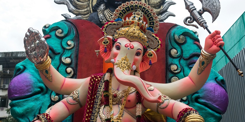 A view of a splendid idol of God in colourful shades and vibrant designs in Maharashtra.