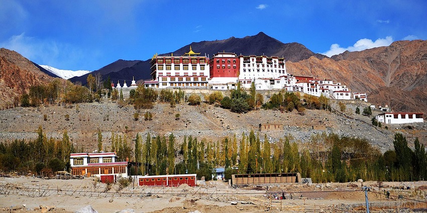 A mesmerising view of a stunning monastery surrounded by rocky hills during the daytime.