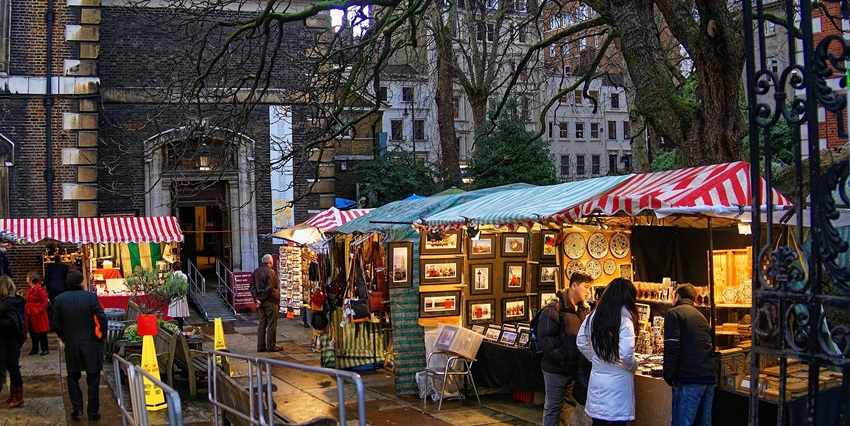 Visitors purchasing at the shops situated near St. James Church in Piccadilly.