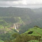 A view of mist-covered hills, among some of the best places near Pune for weekend.