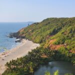 A bird’s eye view of the pristine golden sands, glistening waters and tall palm trees.