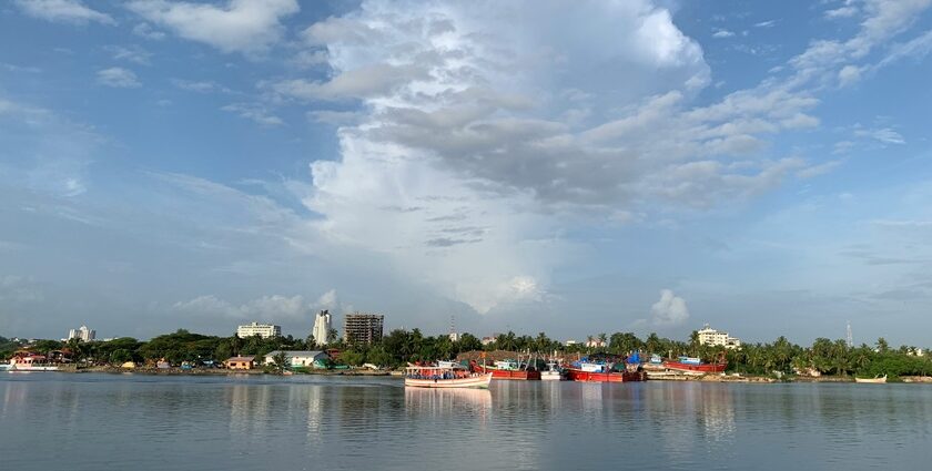 A mesmerising view of a city in Karnataka surrounded by shimmering blue waters.