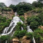 A stunning view of a waterfall, showcasing its intricate architecture and vibrant colours.