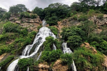 A stunning view of a waterfall, showcasing its intricate architecture and vibrant colours.