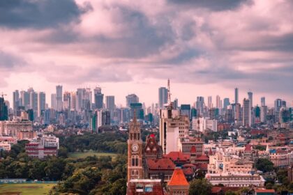 A vibrant fusion of modern skyscrapers and historic architecture gleams.