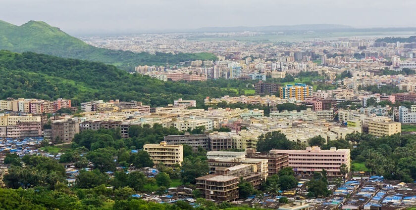 A vibrant aerial view of places to visit in Virar showcasing lush greenery amidst urban buildings.