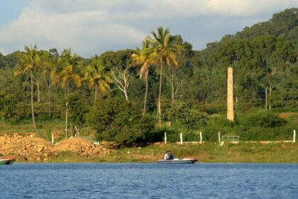 A picture of Yelagiri Lake, which is surrounded by lush greenery and mountains.