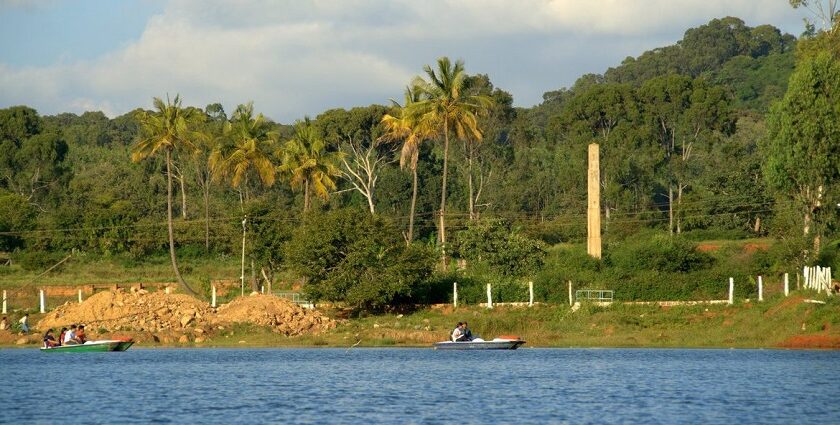 A picture of Yelagiri Lake, which is surrounded by lush greenery and mountains.