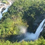 View of Shivanasamudra falls surrounded by lush greenery, one of the most beautiful places to visit near Bangalore in monsoon