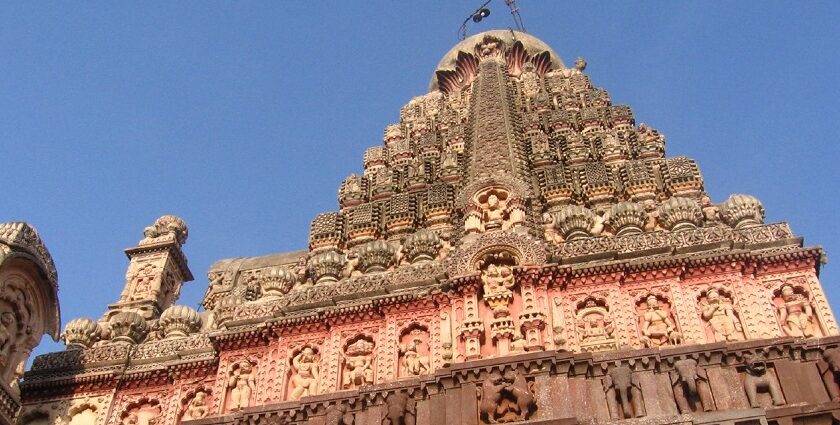 An image of the Grishneshwar Temple, surrounded by lush greenery and historical landmarks.