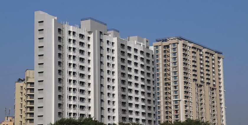 A picture of Mira Road featuring modern buildings and clear blue skies.